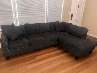 Dark gray sectional couch used for about four months