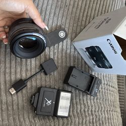 Canon 50mm lens f 1.4 + Flash Unit + Battery Charger + Bluetooth Clicker