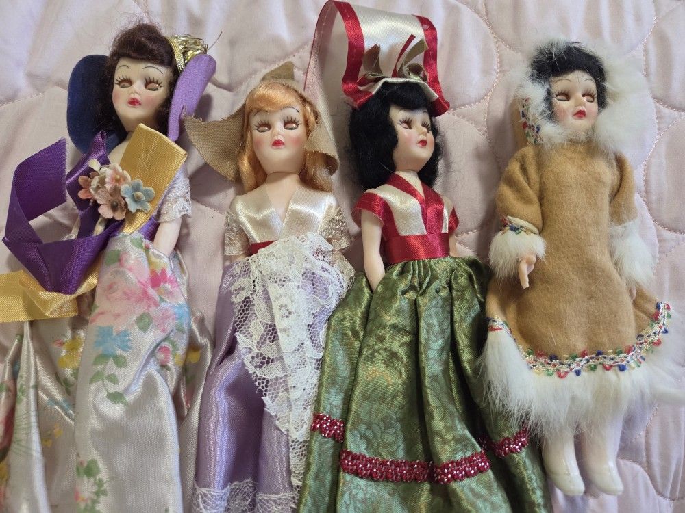 The image shows a set of four vintage "Dolls of the World" from ARCO