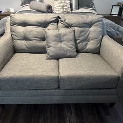 Grey cloth loveseat
