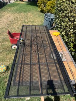 Black metal Security screen door with decorative iron work Black metal Security screen door with decorative ironwork