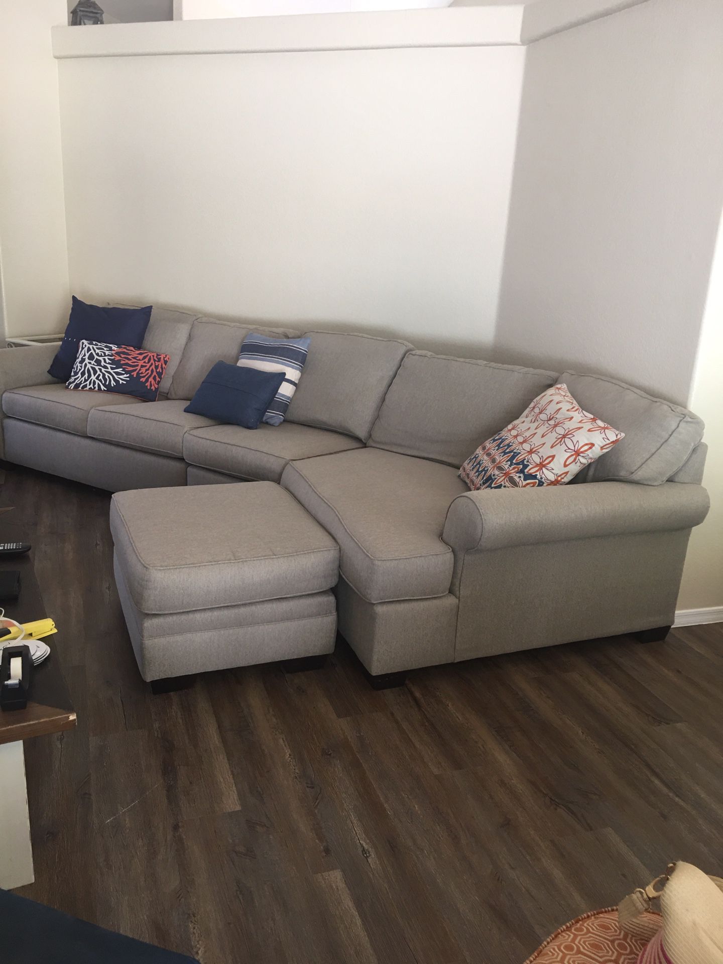Sofa with foot stool 12 1/2 ft long. Cloth. Good condition