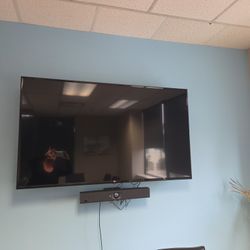 65" LG Flat Screen With Fully Articulating Mount 