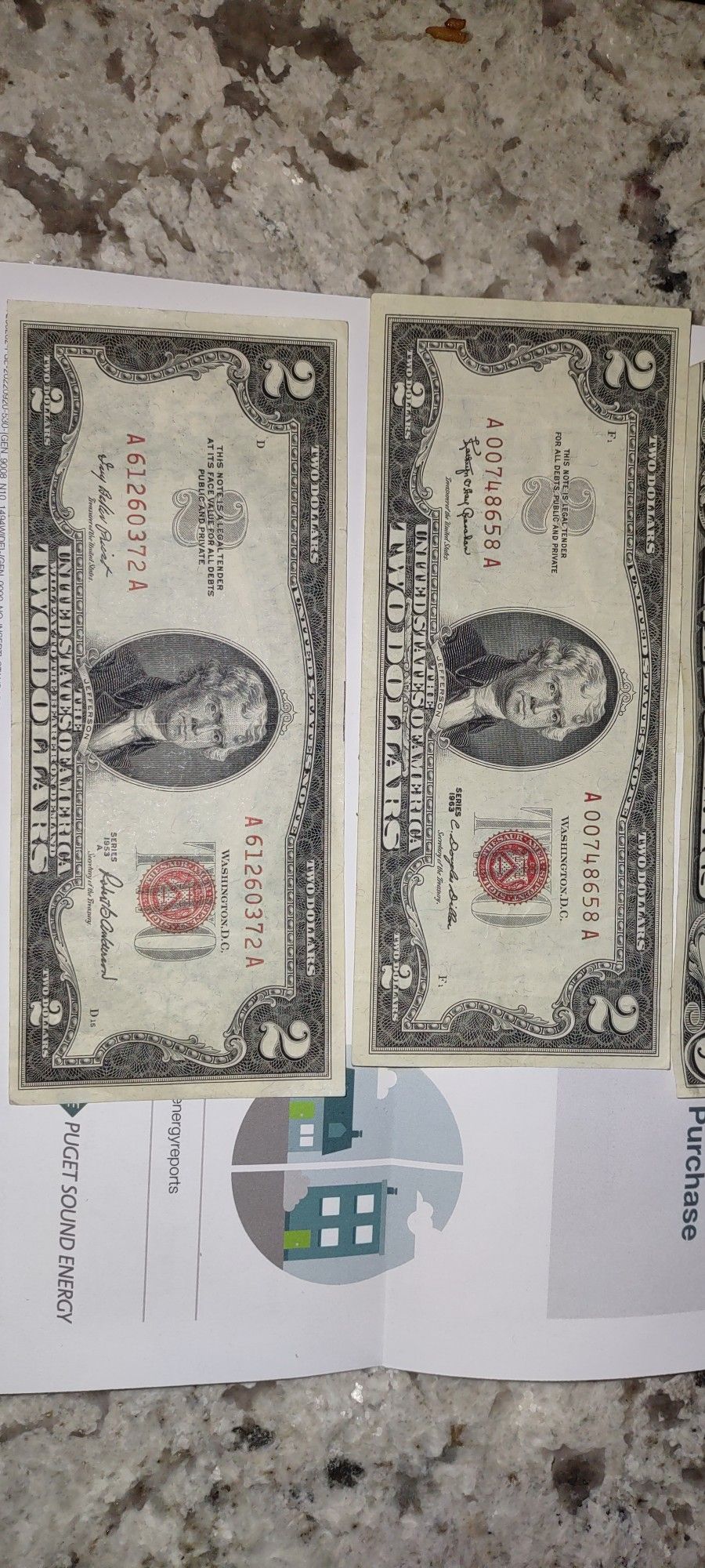 Two Dollars Bill And One Canadá Dollar Bills
