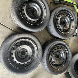 Nissan rims & tires & 3 new tires
