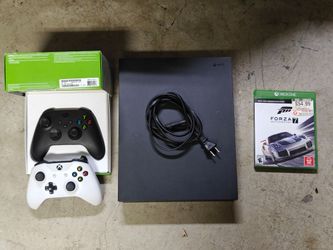 Xbox One X with 2 controllers and Forza 7