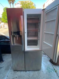 Kenmore side by side refrigerator, stainless steel. Free delivery and installation