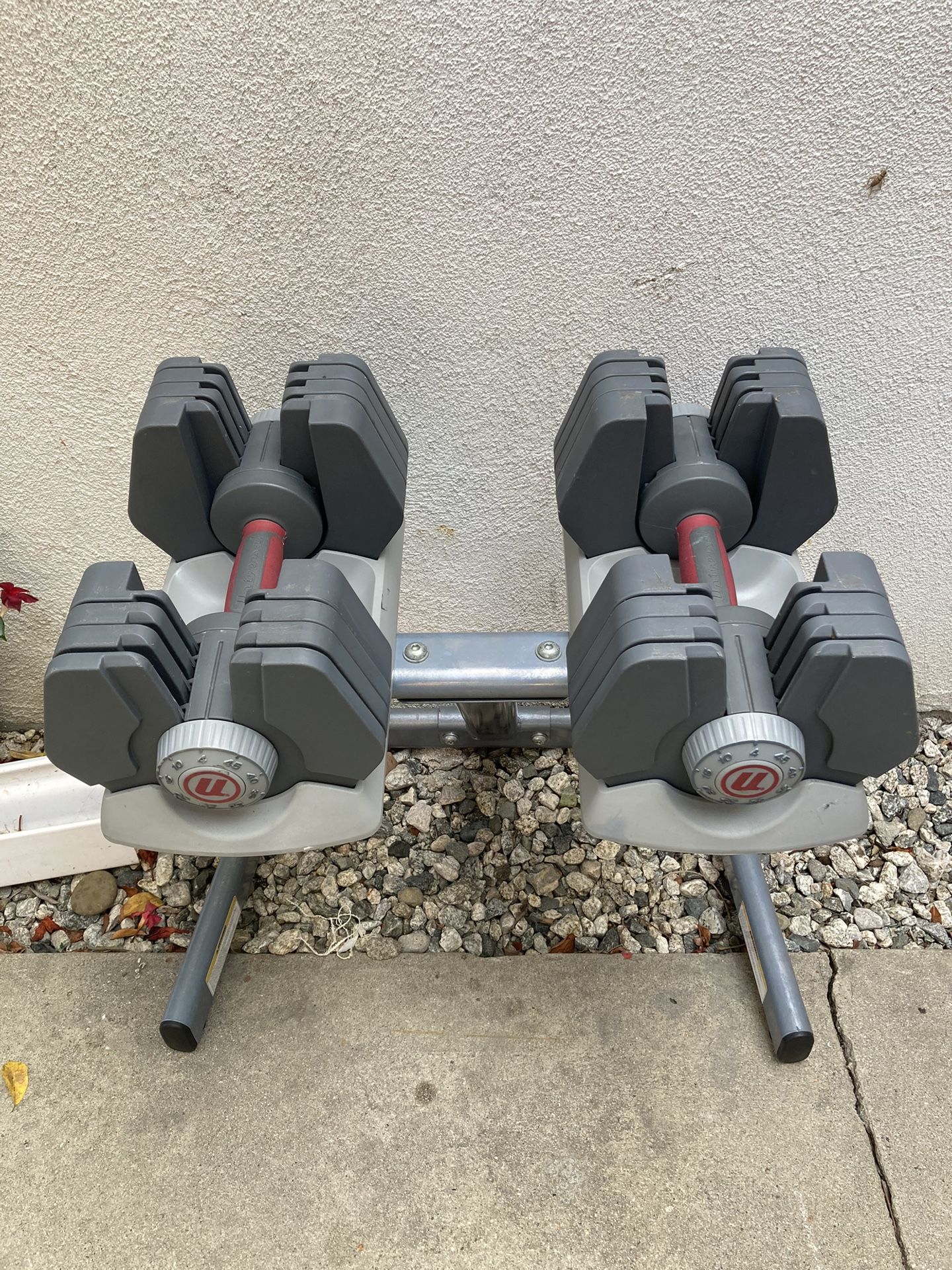 Universal Adjustable Dumbbells With Stand. Can adjust from 4-45lbs with a turn of the knob. They look and work great. $170 takes them