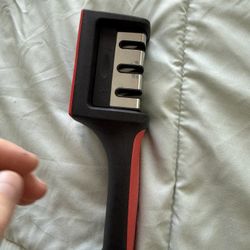 “Knife sharpener, brand new, never used.”