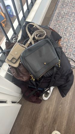 Bag full of women's named brand clothes and shoes
