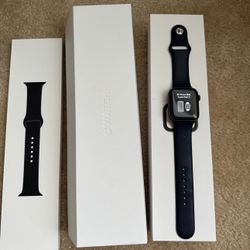 2 Apple Watches 4 And 5 44mm Extra Band For The 5 Both With Boxes