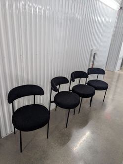 Black boucle dining chairs (set of 4) and dining table
