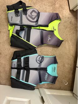 Two life vests  by O’ Brien  surf company