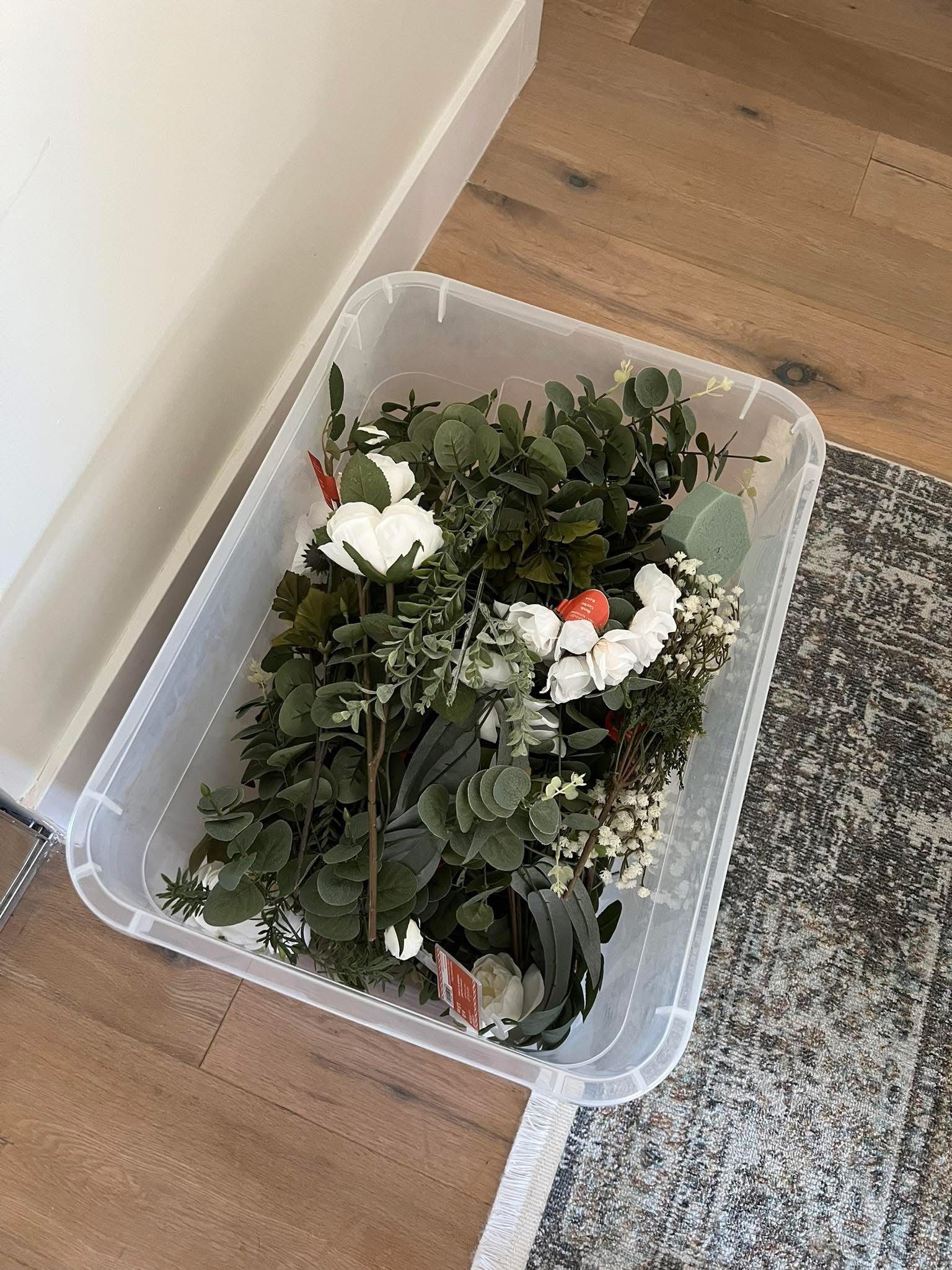 Large tub of greenery and some white florals