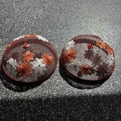 The items shown are decorative mesh food dome covers, commonly used for outdoor dining, BBQs, or picnics to protect food from insects.  These covers t