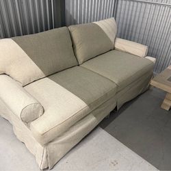 Matching sofa and love seat set, excellent condition. Cover can be removed and washed