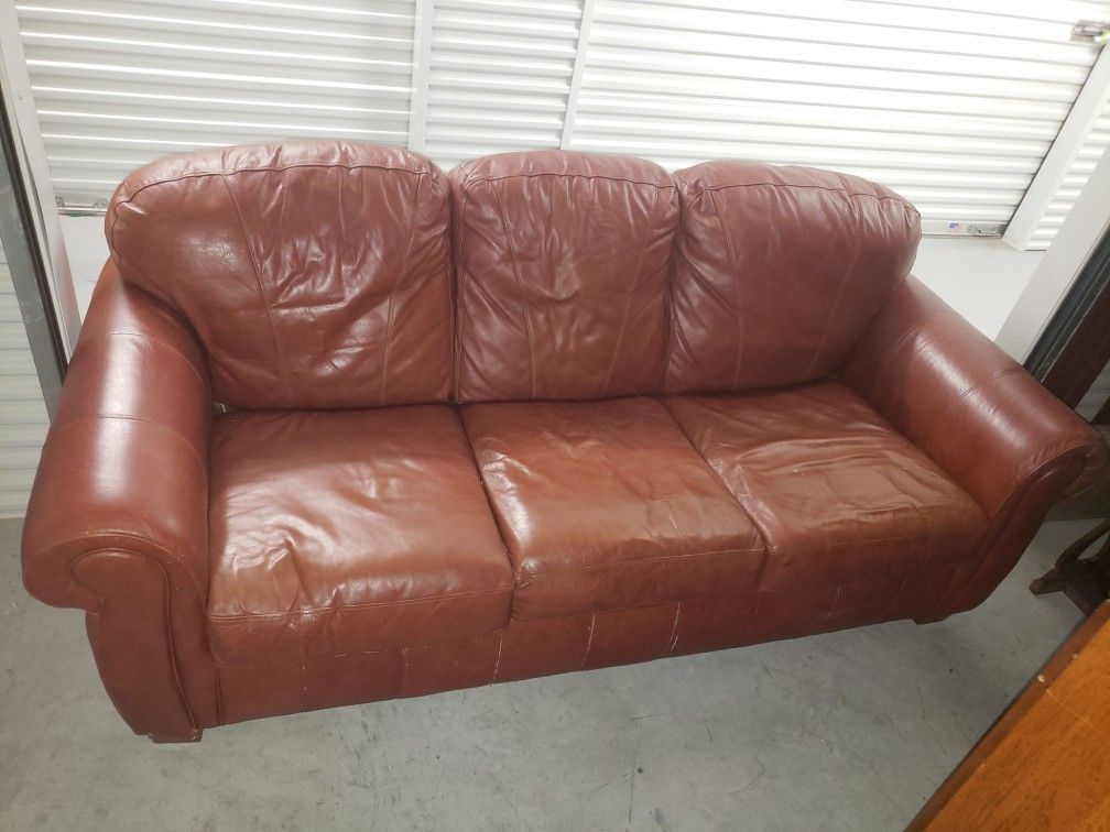 Leather couch with full futon fold out mattress.