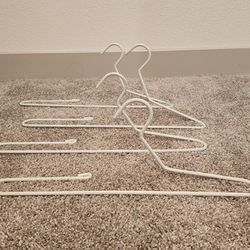 4 - WHITE HANGERS THAT WAS USED FOR TABLE LINEN (21.5" long)