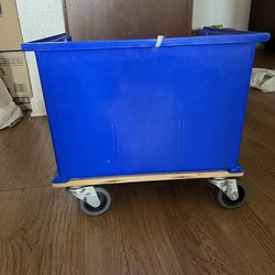 A hand cart featuring four swivel casters on the bottom, designed for carrying heavy loads.