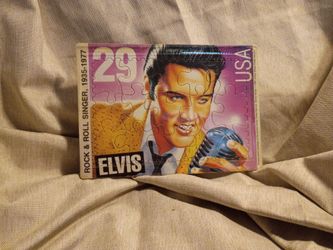 This is a vintage 1992 United States Postal Service (USPS) Elvis Presley 29-cent postage stamp postcard jigsaw puzzle.