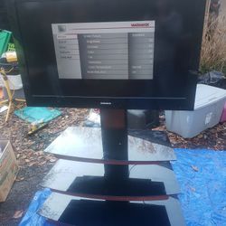 Magnovox 40inch tv with 3 tier glass top stand. TV works great. 