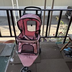 A Pink Dog Stroller