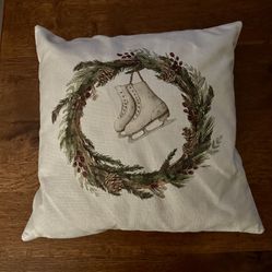 Decorative pillow with wreath and ice skate 