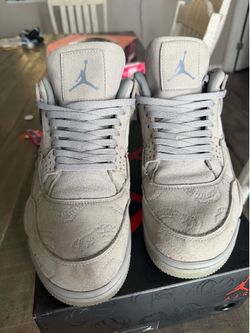 Gray Nike x kaws Jordan 4s