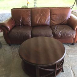 Red leather sofa couch and coffee table