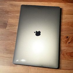 **Apple MacBook Pro 15-inch (2018) w/ Touch Bar - Excellent Condition, Minor Cosmetic Flaw**

