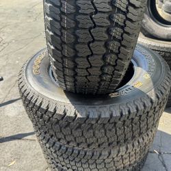 SET OF 4 TIRES LT275/65/18 GOODYEAR WRANGLER  95% TREAD LIFE LEFT