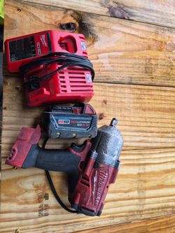 Milwaukee  fuel 1/2 impact  battery and charger