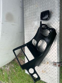 Black car interior console trim pieces for a C5 Corvette