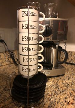 Espresso cups with dishes and rack