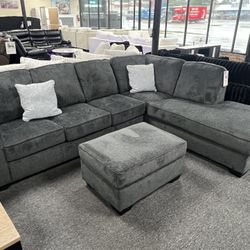 New Dark Gray Sectional By Ashley. Ottoman $199 More. Delivery & Set Up Available 