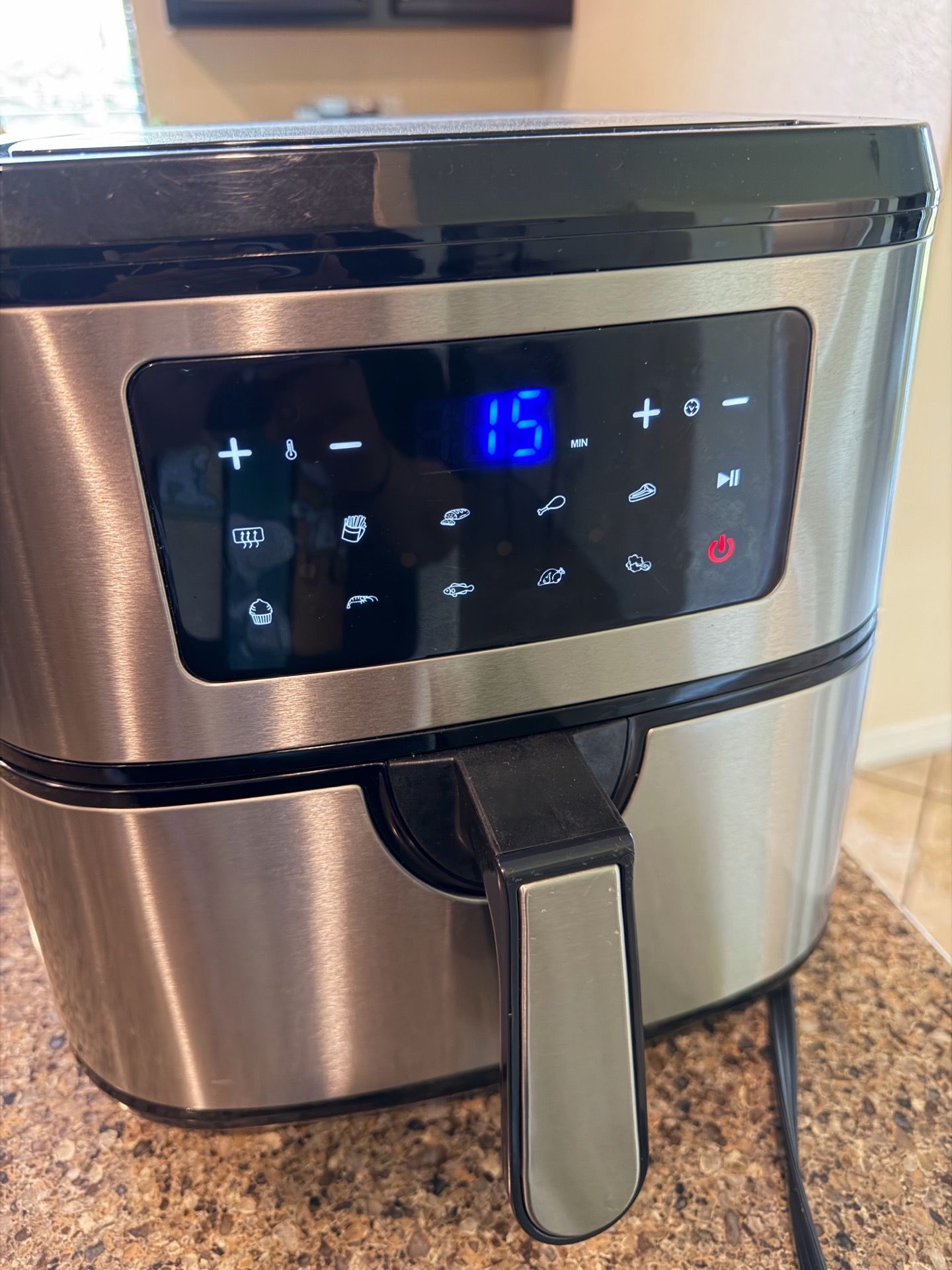 Ruigo branded air fryer with a black and silver finish