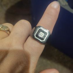 MEN'S BLACK STAINLESS STEEL DANBURY MINT RING WITH 4 SMALL DIAMONDS (ENGRAVED INSIDE WITH THE NAME DONALD)  