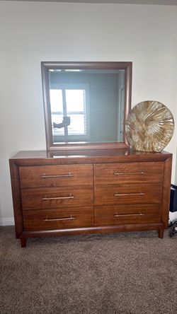 Modern dresser intact no scratches all drawers work fine .