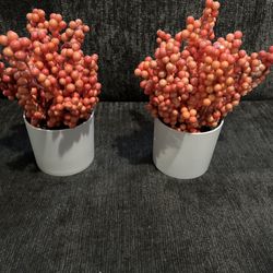 Set of two artificial Orange berry plants in white pots.
