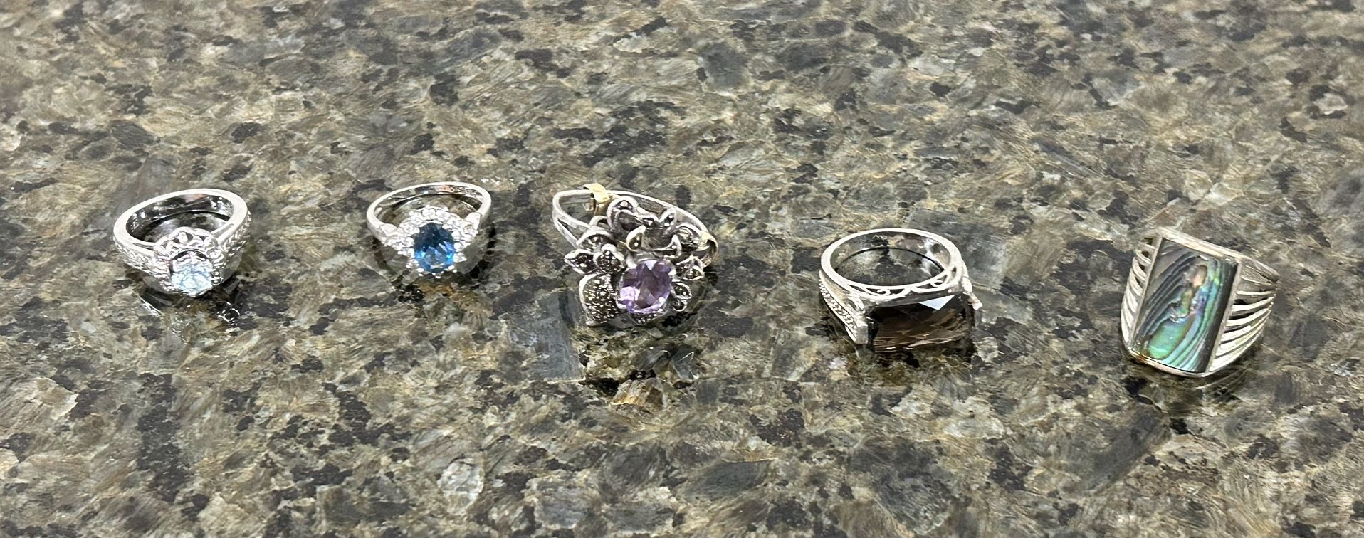 Five Sterling Women’s Rings marked 925 with Gemstones.