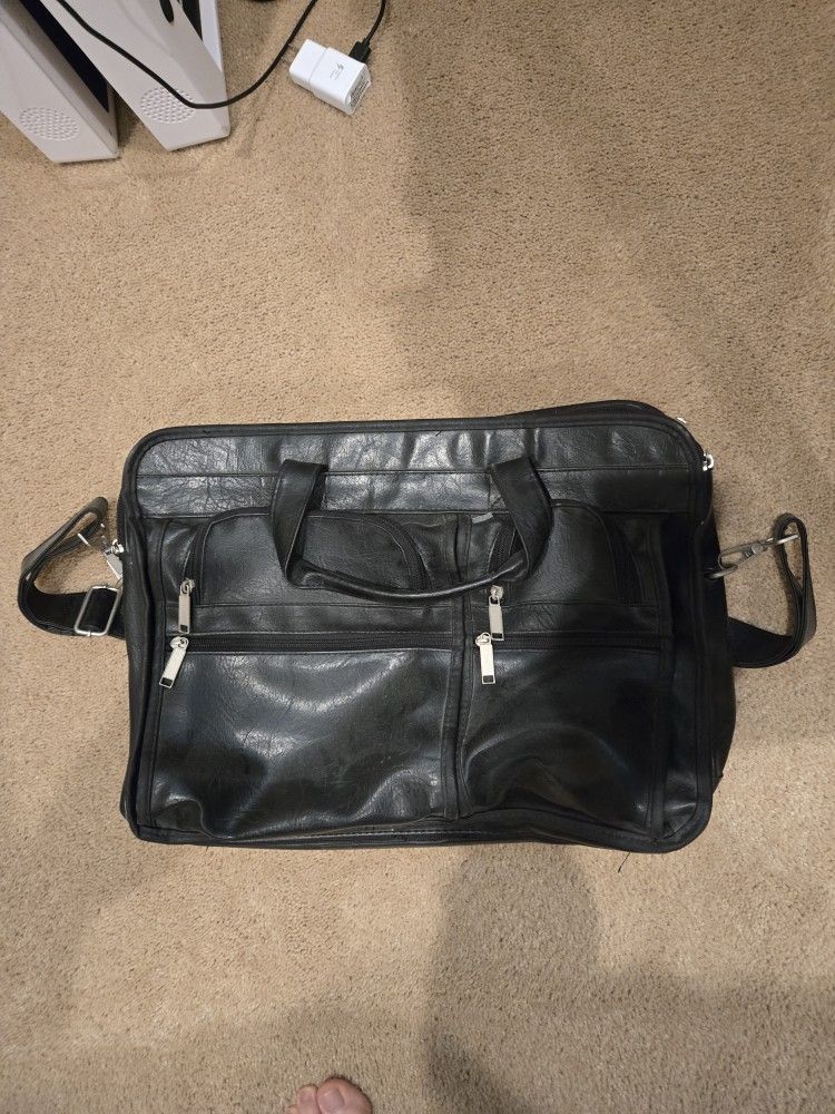 Leather Exapandable Messenger bag with dividers.