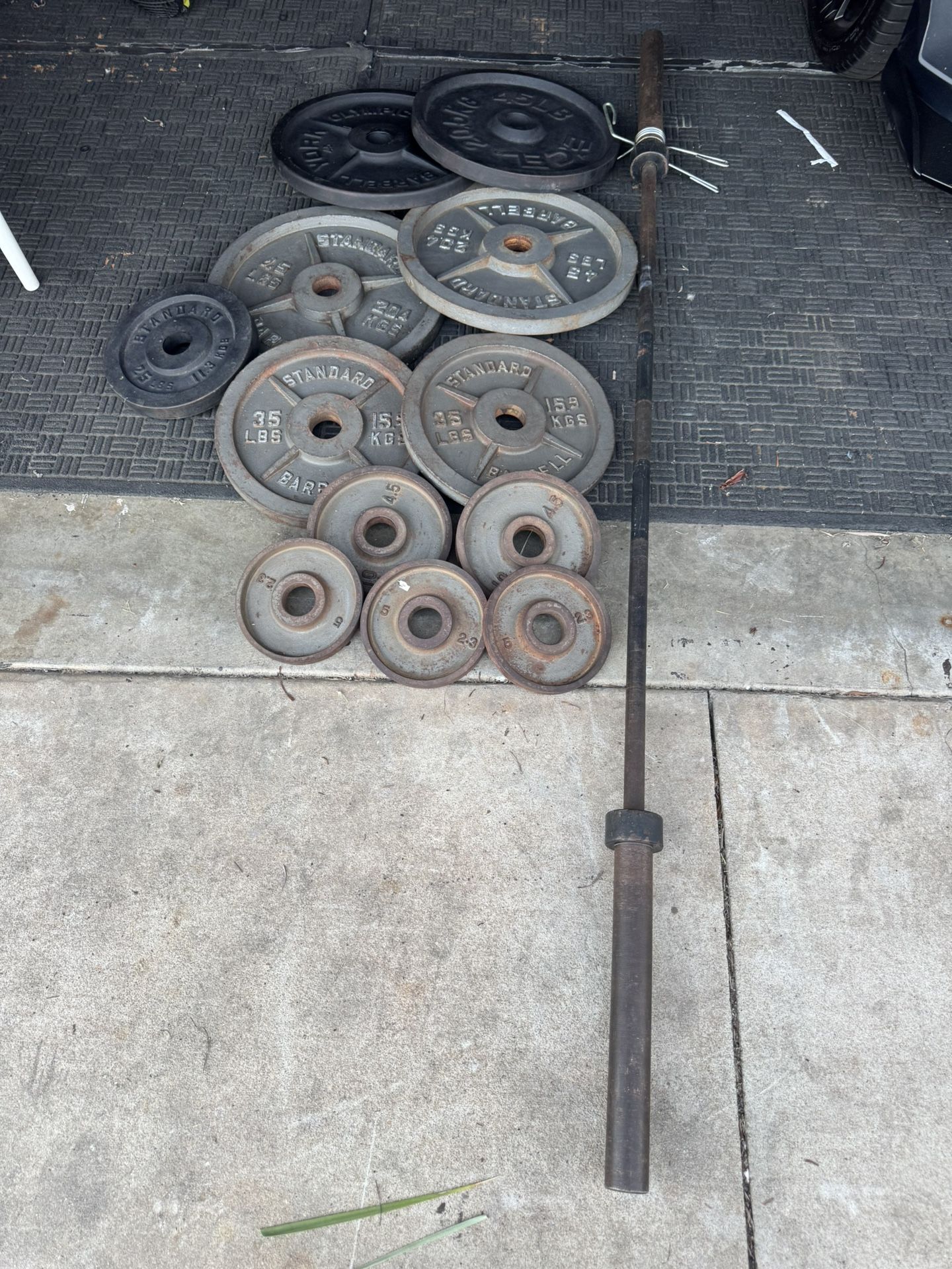 Olympic weights set 310lbs total plus 7ft 45lbs bar
