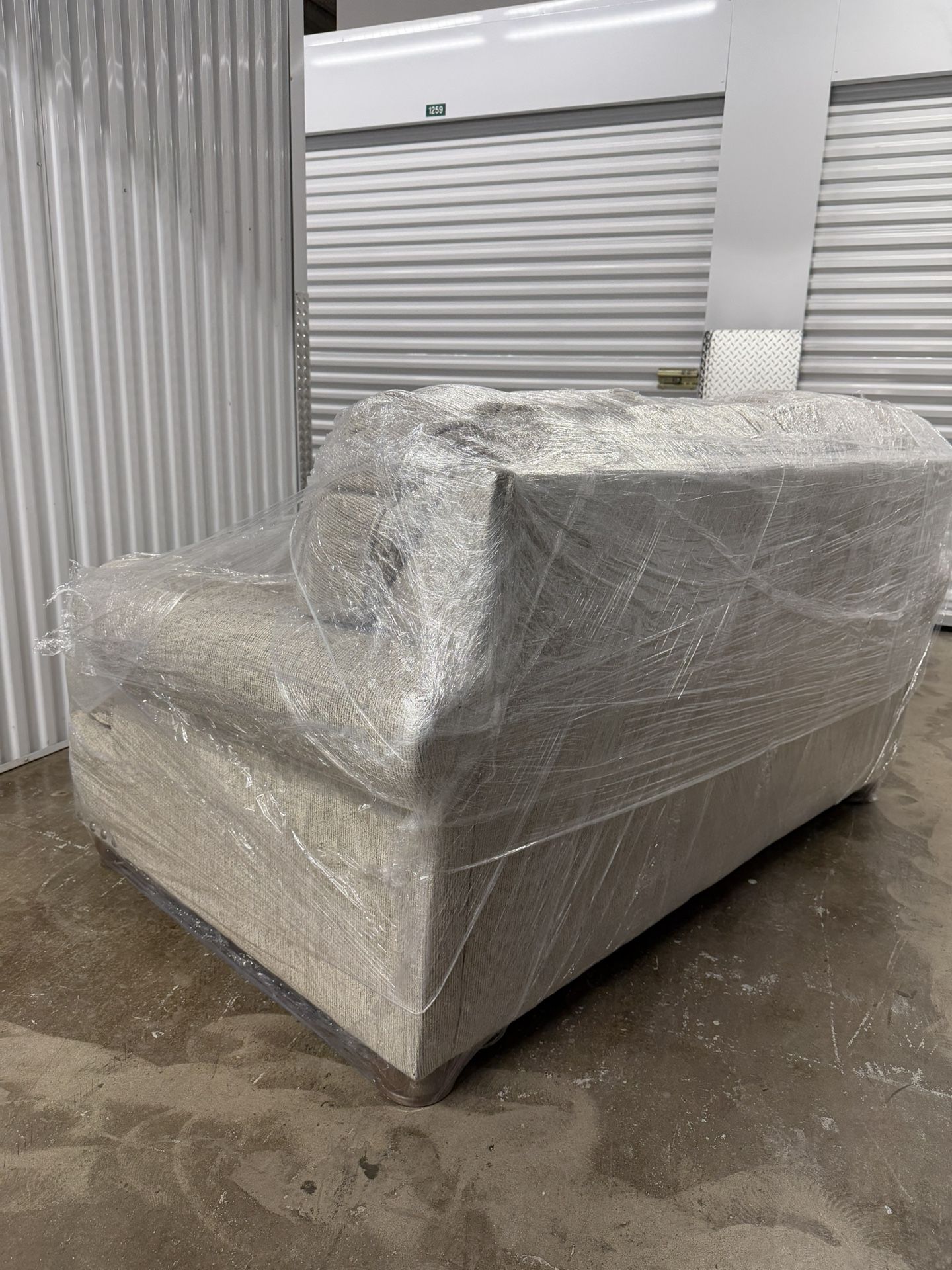 Beige loveseat in excellent condition - barely used! $300 OBO