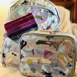 Holo Sticker Pocket Backpack & Wristlet and lunch box. New with tags. Girls love them! Backpack 11.5" W x 5.5" L x 16" H.  Wristlet 9.75” x 6.25”. Lun