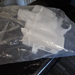 TRQ windshield washer reservoir, likely for a 2014-2019 Toyota Corolla.