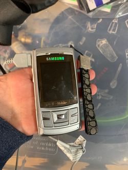 Samsung t-mobile phone with charger and Coach holder