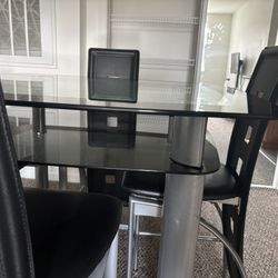Gently used Double Glass Dining Table 