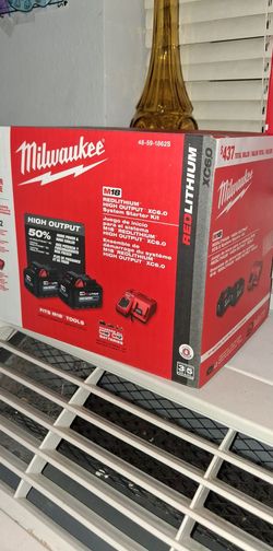 Milwaukee batteries charger & 1/2 inch impact wrench