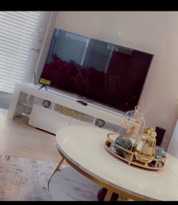 TV , TV STAND, AND CENTER TABLE WITH DECORATION
