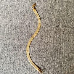 Gold tone herringbone bracelet